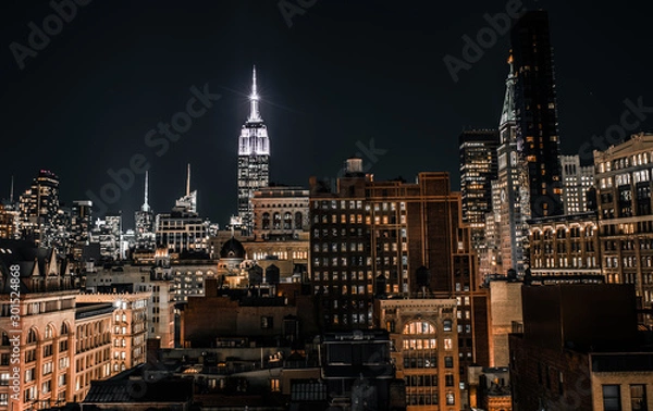 Obraz Night time viw of Manhattan skyscrapers with the Empire State Building