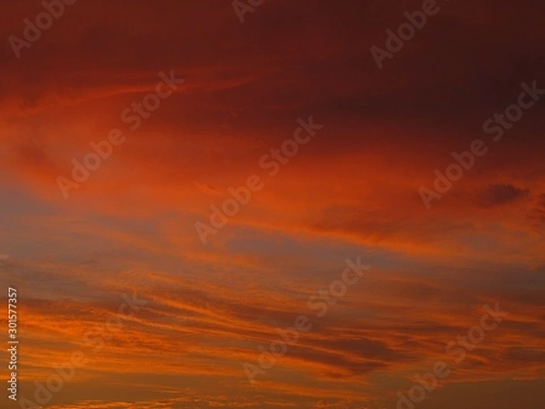Fototapeta An orange evening sky with clouds