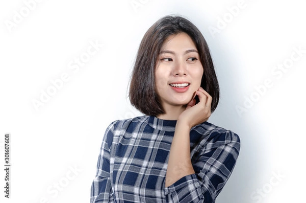 Obraz Beautiful smiling woman with clean skin, natural make-up, and white teeth on grey background