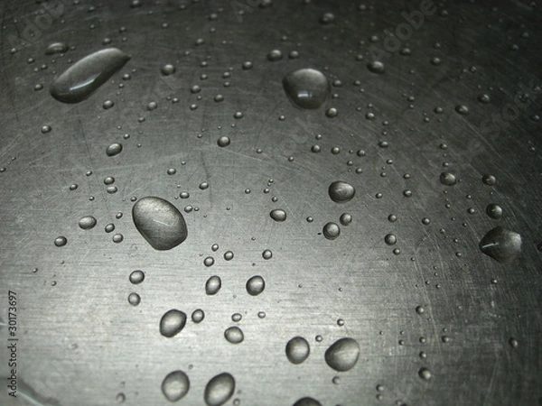 Obraz Water drops on an iron surface.