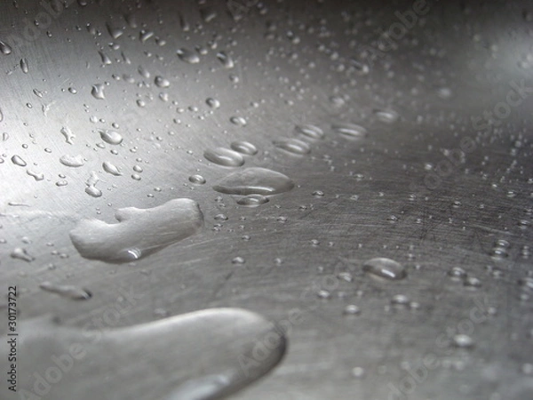 Obraz Water drops on an iron surface.