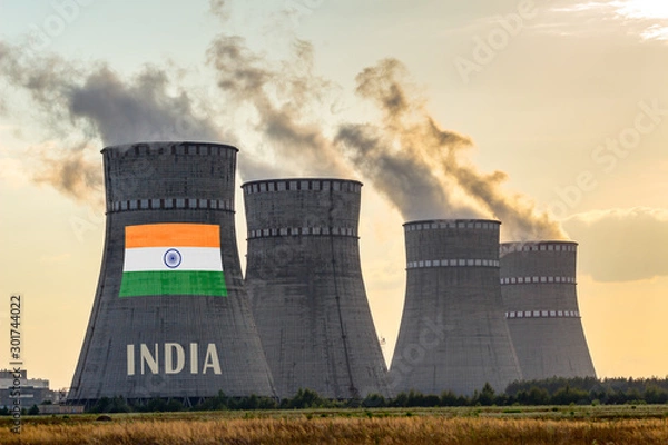 Fototapeta Nuclear plant chimneys displaying flag of India with according text. Energy pollution accidents in the country concept. Power production and generation from atomic energy.