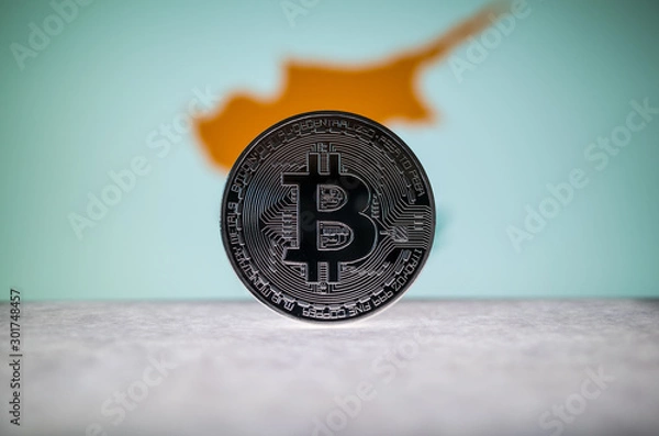 Fototapeta Physical silver version of Bitcoin BTC and Cyprus Flag on the background. Conceptual image for investors in cryptocurrency and Blockchain.