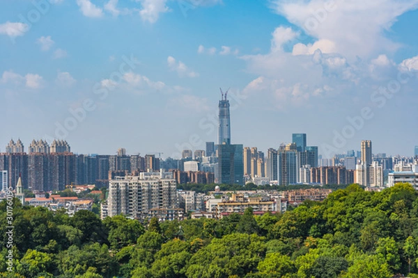 Fototapeta Wuhan skyline and Yangtze river with supertall skyscraper under construction in Wuhan Hubei China.