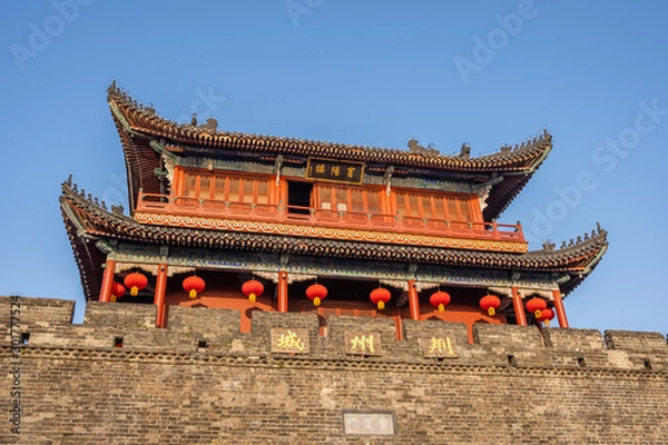 Fototapeta Traditional facade of buildings, exterior of buildings,loated Jingzhou China.Close-up of historic buildings.There china letters on building is"Jingzhou gate" builded in the Three Kingdoms Period.