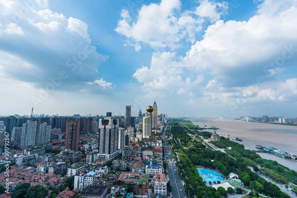 Fototapeta Wuhan skyline and Yangtze river with supertall skyscraper under construction in Wuhan Hubei China.