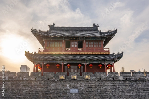 Fototapeta Traditional facade of buildings, exterior of buildings,loated Jingzhou China.Close-up of historic buildings.There china letters on building is"Jingzhou gate" builded in the Three Kingdoms Period.
