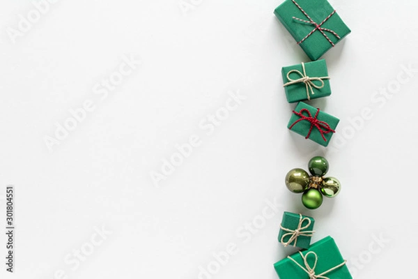 Fototapeta Christmas composition. Gift bauble top view background with copy space for your text. Flat lay.