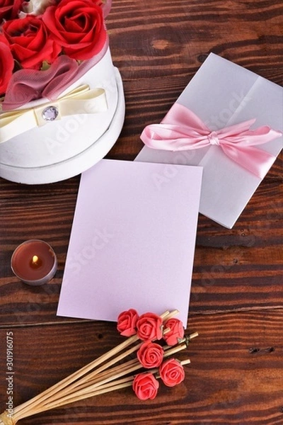 Obraz Gift box with flowers on wooden background, preparation for the holiday concept. Top view and copy area for text.