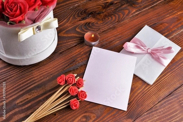 Obraz Gift box with flowers on wooden background, preparation for the holiday concept. Top view and copy area for text.