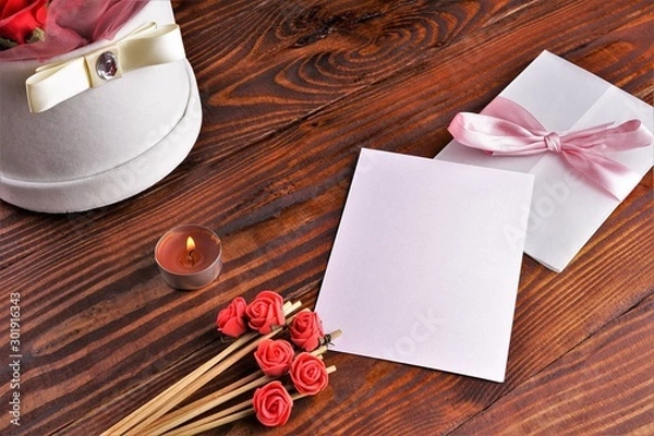 Obraz Gift box with flowers on wooden background, preparation for the holiday concept. Top view and copy area for text.