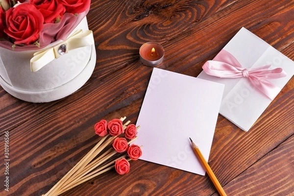 Obraz Gift box with flowers on wooden background, preparation for the holiday concept. Top view and copy area for text.