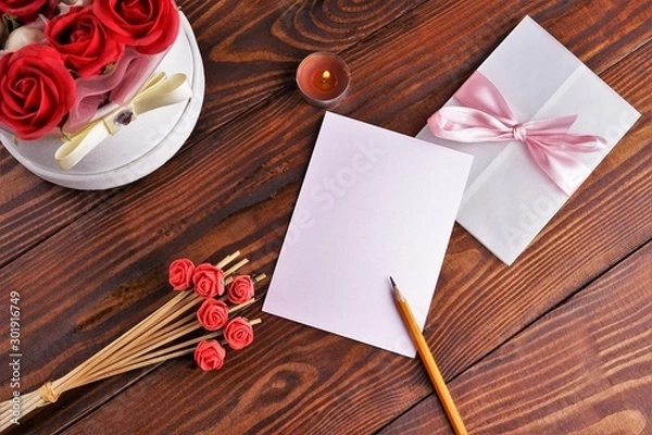 Obraz Gift box with flowers on wooden background, preparation for the holiday concept. Top view and copy area for text.