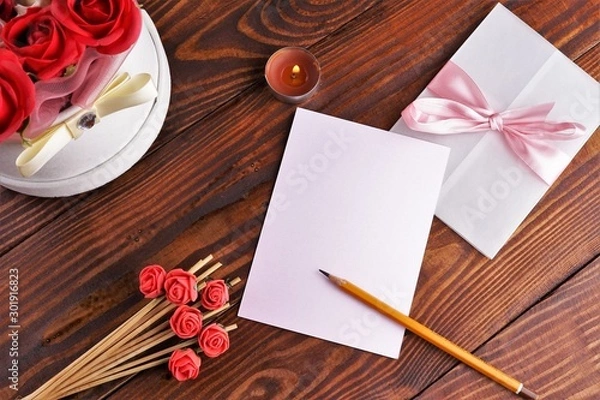 Obraz Gift box with flowers on wooden background, preparation for the holiday concept. Top view and copy area for text.
