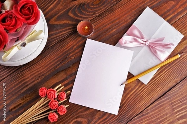 Obraz Gift box with flowers on wooden background, preparation for the holiday concept. Top view and copy area for text.