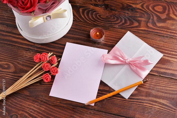Obraz Gift box with flowers on wooden background, preparation for the holiday concept. Top view and copy area for text.