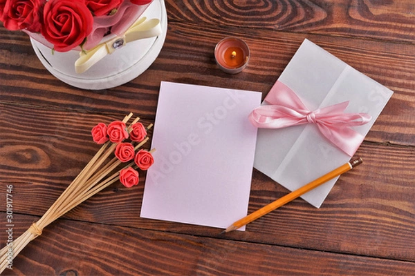 Obraz Gift box with flowers on wooden background, preparation for the holiday concept. Top view and copy area for text.