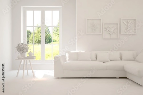 Fototapeta Mock up of stylish room in white color with sofa and green landscape in window. Scandinavian interior design. 3D illustration