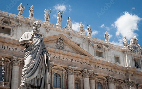 Fototapeta St. Peter, Vatican City. Low angle view of the statue of St. Peter in St. Peter's Square, Vatican City, with the façade of the Basilica behind.