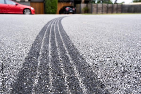 Fototapeta Tire track mark on asphalt made by hard vehicle braking