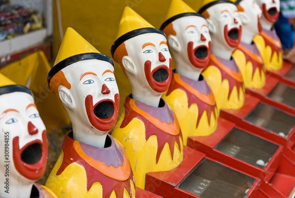 Obraz Brightly colored sideshow clowns at a circus..