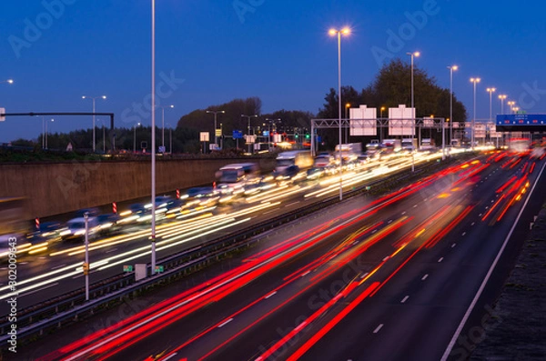 Fototapeta Evening rush hour on the motorway near the Gouwe aquaduct (Gouda, A12) in the Netherlands. Long shutter/exposure speed image.