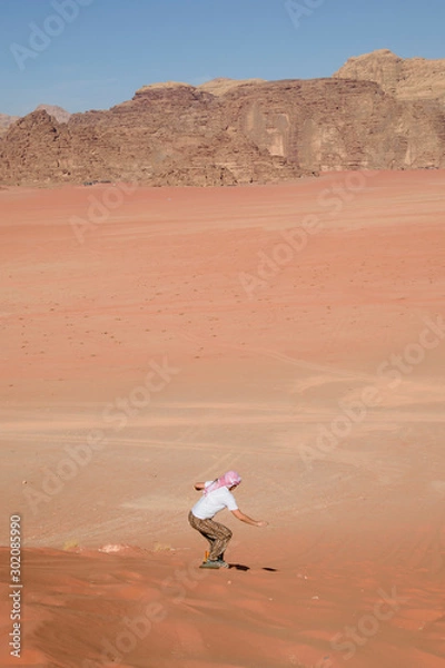 Obraz A man riding a sandboarding