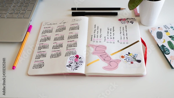 Fototapeta Journal life style, Bullet Journal - Planer - Notebook - top view with utensils arranged on white background, orchid, pencils, sticky notes