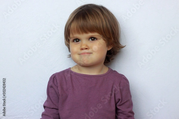 Fototapeta Portrait of a cute baby with brown eyes