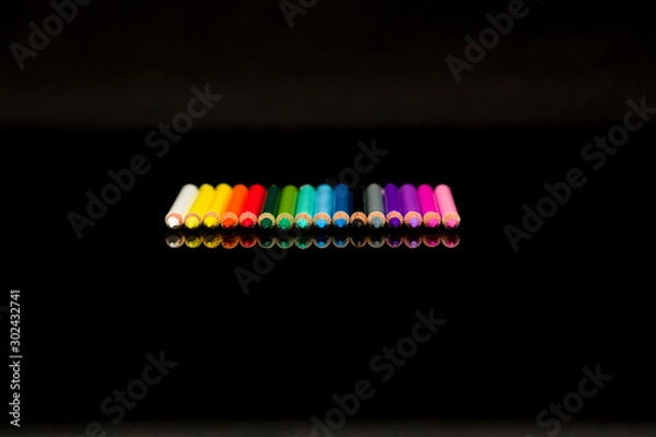 Fototapeta Color pencil on black background