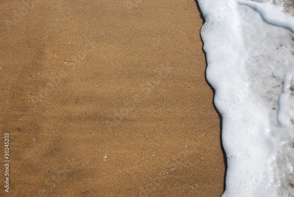 Fototapeta Strandszene mit Meer und Gischt