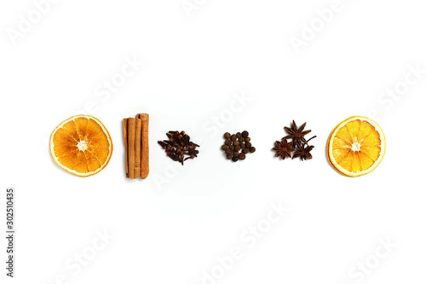 Fototapeta Composition made of dried orange, cinnamon, black pepper, star anice and clove on white background. Top view, copy space. Set of spices for mulled wine.