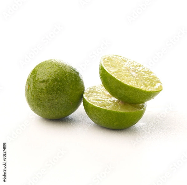 Obraz Limes with half isolated on white background