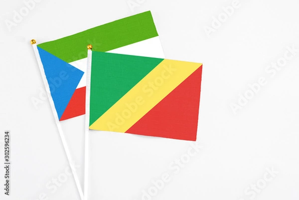 Obraz Republic Of The Congo and Equatorial Guinea stick flags on white background. High quality fabric, miniature national flag. Peaceful global concept.White floor for copy space.