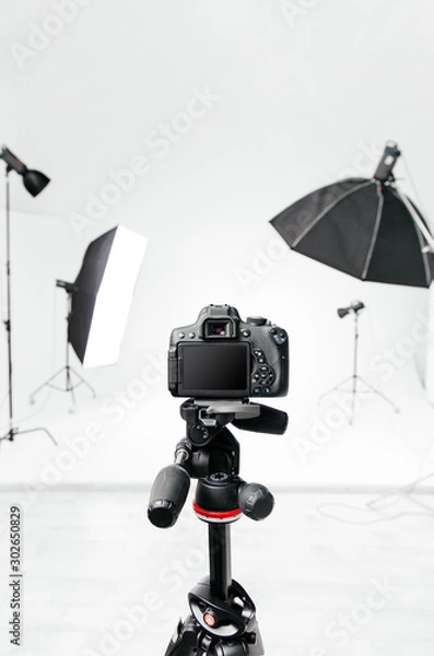 Obraz Empty photo studio with lighting equipment and camera