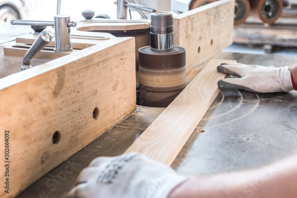Fototapeta working in a carpentry workshop