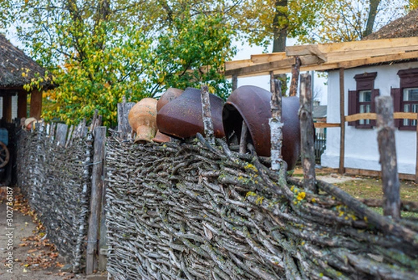 Obraz pots on the fence Cossack farmstead