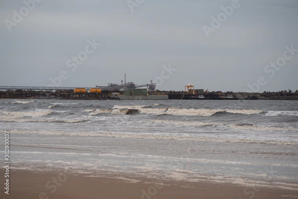 Fototapeta Rough Sea at ship loader, Port Latta. Overcast day. 