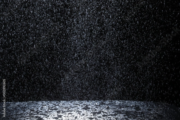 Fototapeta Dark background shot of rain falling