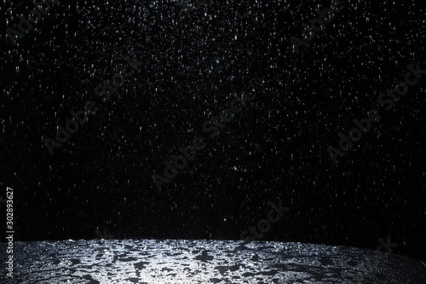 Fototapeta Dark background shot of rain falling