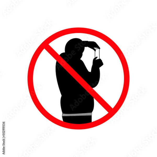 Fototapeta No photo - round prohibiting sign. Crossed out man silhouette with mobile phone
