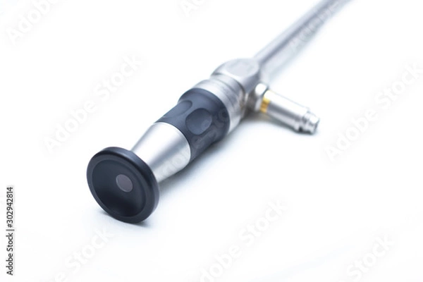 Fototapeta Surgical laparoscapia camera for surgery in urology of the kidneys, on a white isolated background. Optics Arthroscopy changes the angle of the angle from 0 to 120 degrees