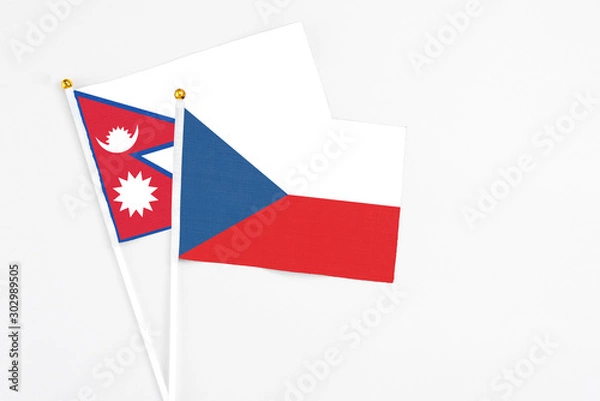Fototapeta Czech Republic and Nepal stick flags on white background. High quality fabric, miniature national flag. Peaceful global concept.White floor for copy space.