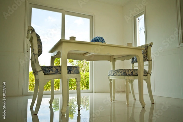 Fototapeta Two chais and table in dining room