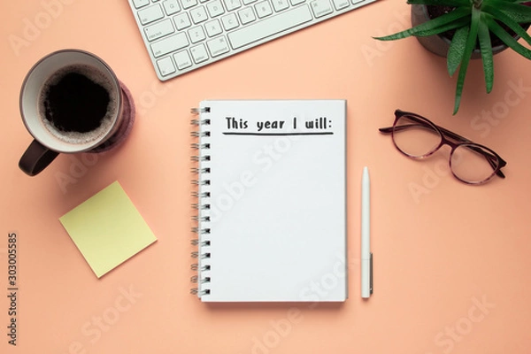 Fototapeta Stock photo of 2020 new year notebook with list of resolutions and objects on pink background