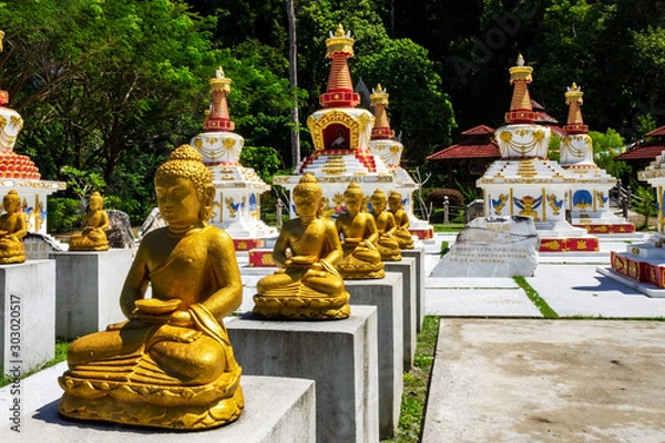 Fototapeta Buddhas and stupas in Wat Wanararm or What Kho Wanararm Temple in Langkawi island, also known as Pulau Langkawi, State of Kedah, Malaysia.