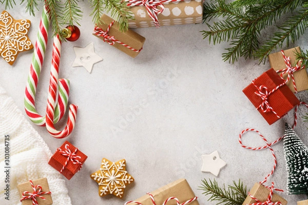 Fototapeta Christmas background with gift boxes, sweets and decoration.