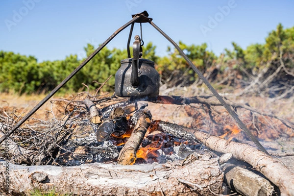 Fototapeta kettle basked on a fire