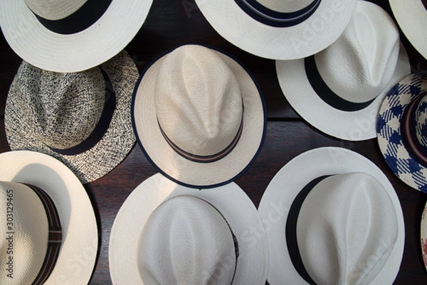 Fototapeta Set of several white panama hats exposed in a shop