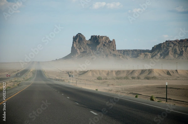 Obraz Road trough desert with sand storm in USA